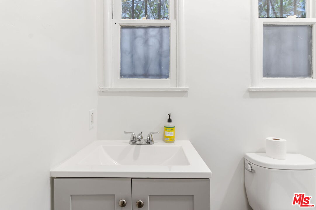 2302 Bagley Avenue Los Angeles, CA 90034 - Photo 17 of 20 a bathroom with a sink and a toilet