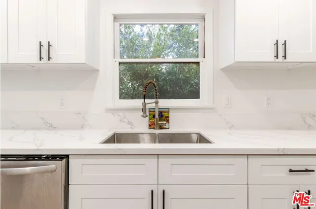 a kitchen with a sink and a window