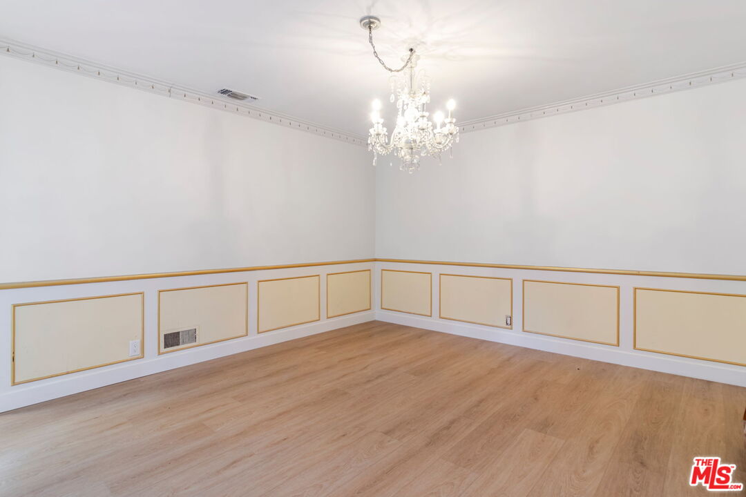 2302 Bagley Avenue Los Angeles, CA 90034 - Photo 4 of 20 a view of an empty room with chandelier