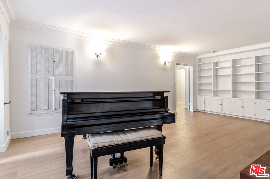 2302 Bagley Avenue Los Angeles, CA 90034 - Photo 6 of 20 a view of room with wooden floor and cabinet