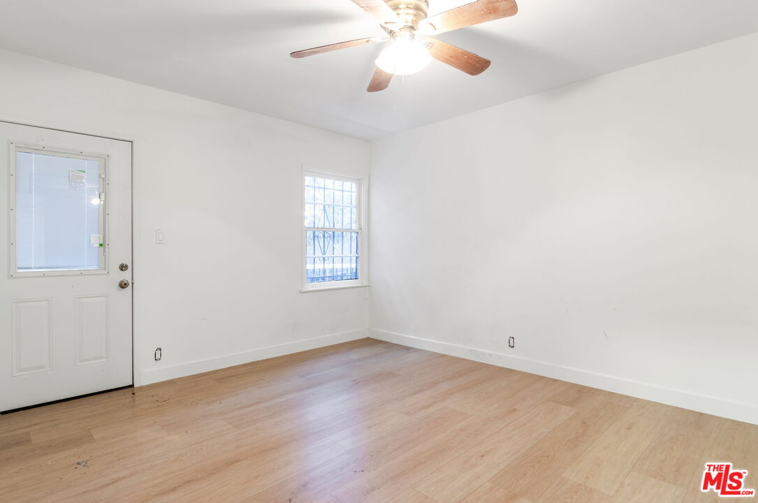 2302 Bagley Avenue Los Angeles, CA 90034 - Photo 7 of 20 wooden floor in an empty room with a window