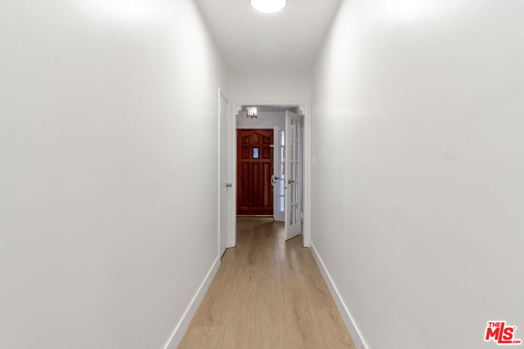 2302 Bagley Avenue Los Angeles, CA 90034 - Photo 10 of 20 a view of a hallway with wooden floor