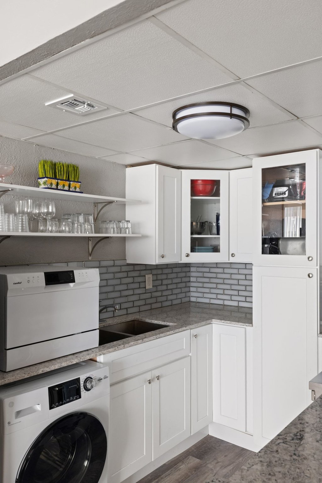 1800 Lavaca Street, Unit 207 Austin, TX 78701 - Photo 19 of 24 Laundry area featuring washer / clothes dryer, dark wood-style floors, and a paneled ceiling