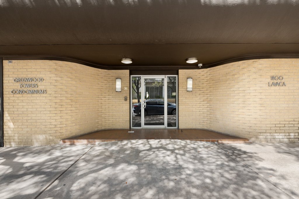 1800 Lavaca Street, Unit 207 Austin, TX 78701 - Photo 8 of 24 Property entrance featuring brick siding and a patio area