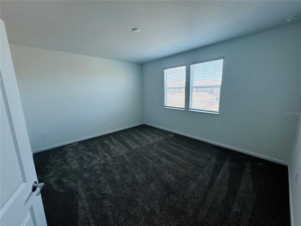 1952 Rider Rain Lane Apopka, FL 32703 - Photo 16 of 34 an empty room with a window