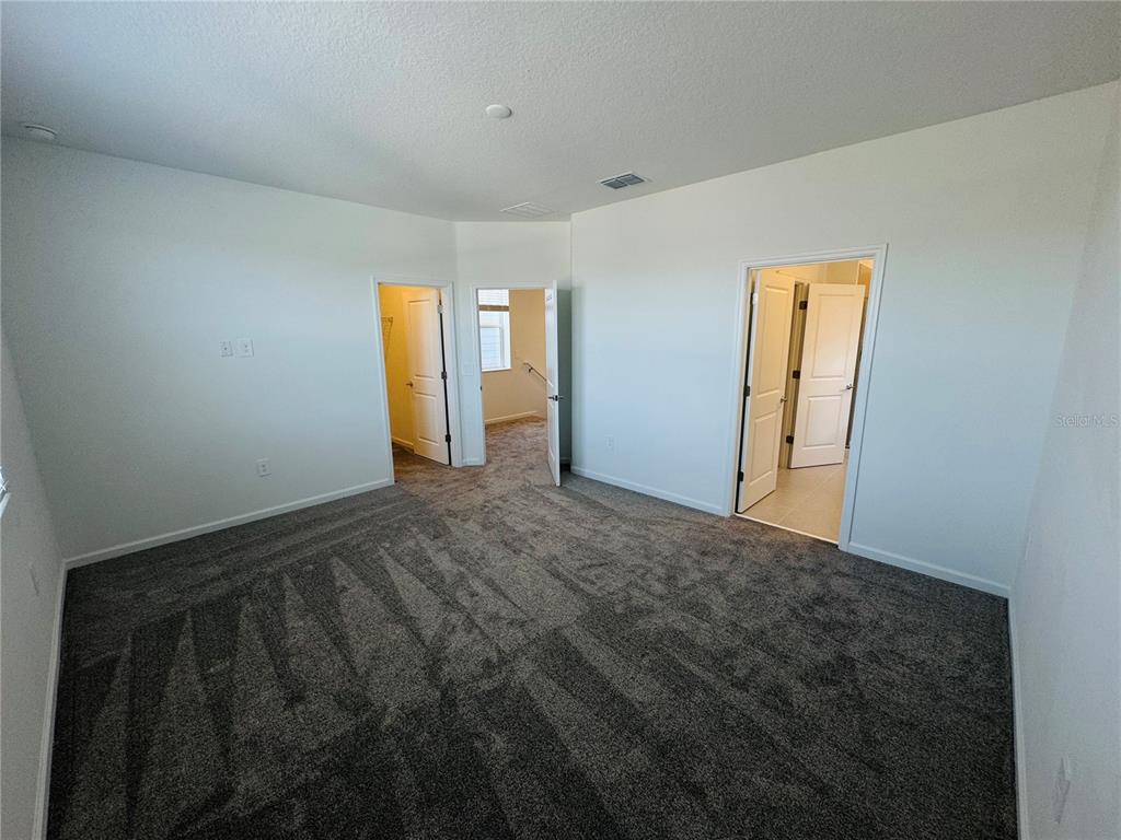 1952 Rider Rain Lane Apopka, FL 32703 - Photo 18 of 34 a view of an empty room