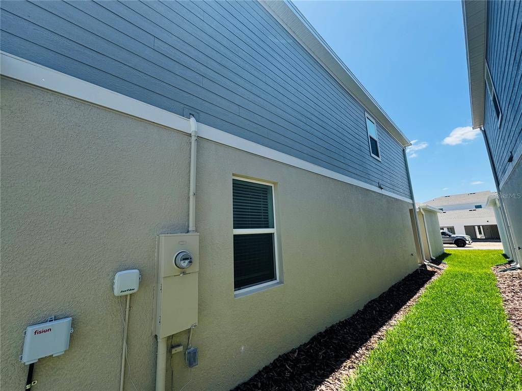 1952 Rider Rain Lane Apopka, FL 32703 - Photo 2 of 34 a view of a backyard with pathway