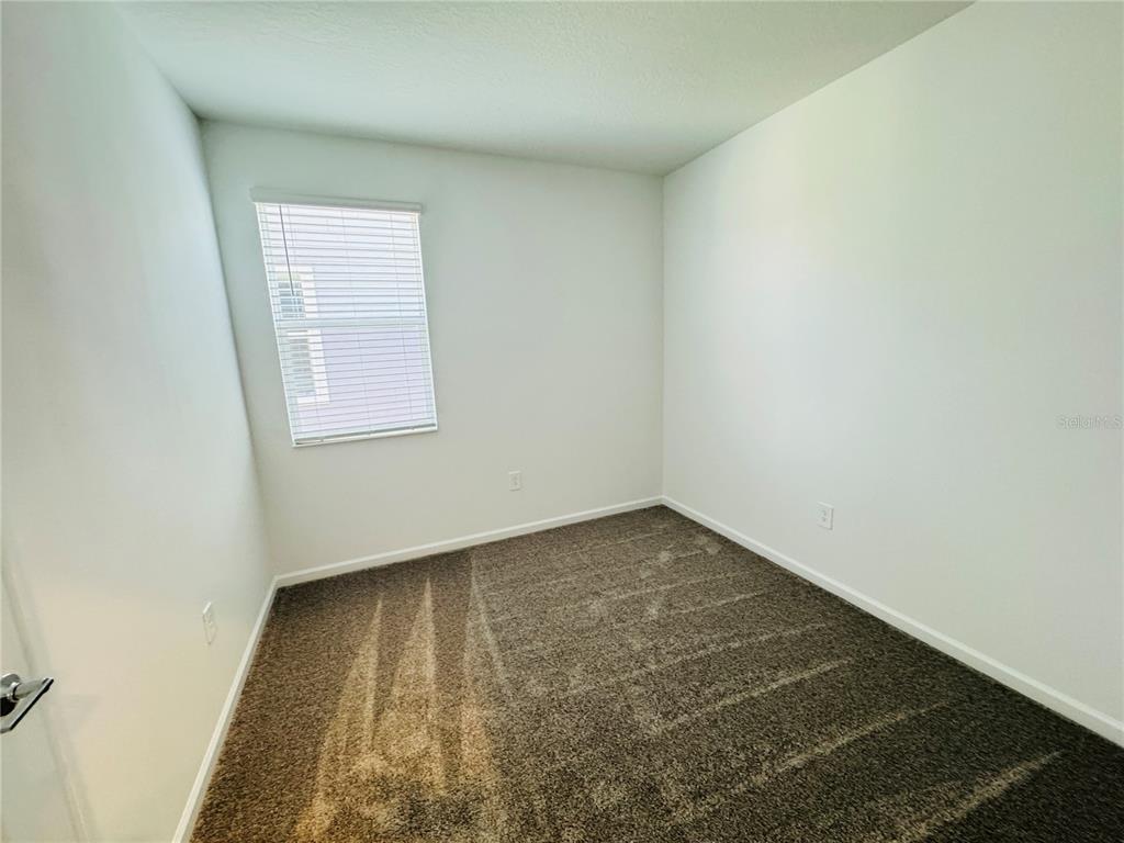 1952 Rider Rain Lane Apopka, FL 32703 - Photo 25 of 34 an empty room with a window