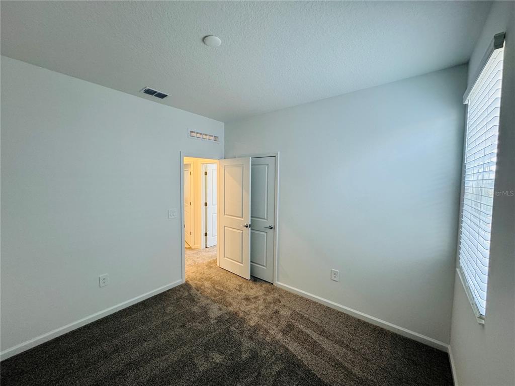 1952 Rider Rain Lane Apopka, FL 32703 - Photo 26 of 34 an empty room with windows