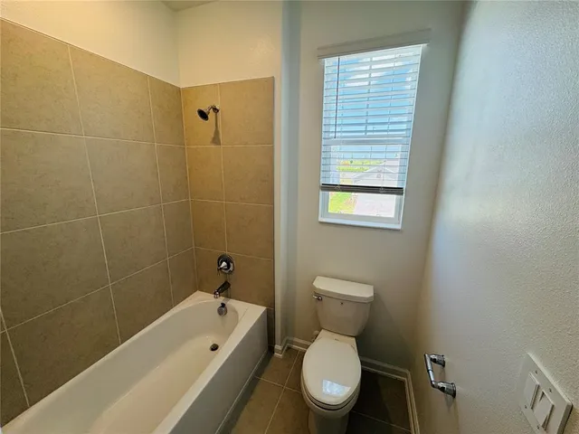 a bathroom with a double vanity sink and mirror
