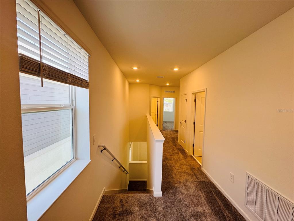 1952 Rider Rain Lane Apopka, FL 32703 - Photo 31 of 34 a view of a hallway with the view and staircase
