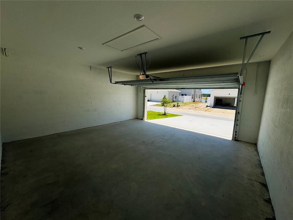 1952 Rider Rain Lane Apopka, FL 32703 - Photo 32 of 34 a view of a room with gym equipment