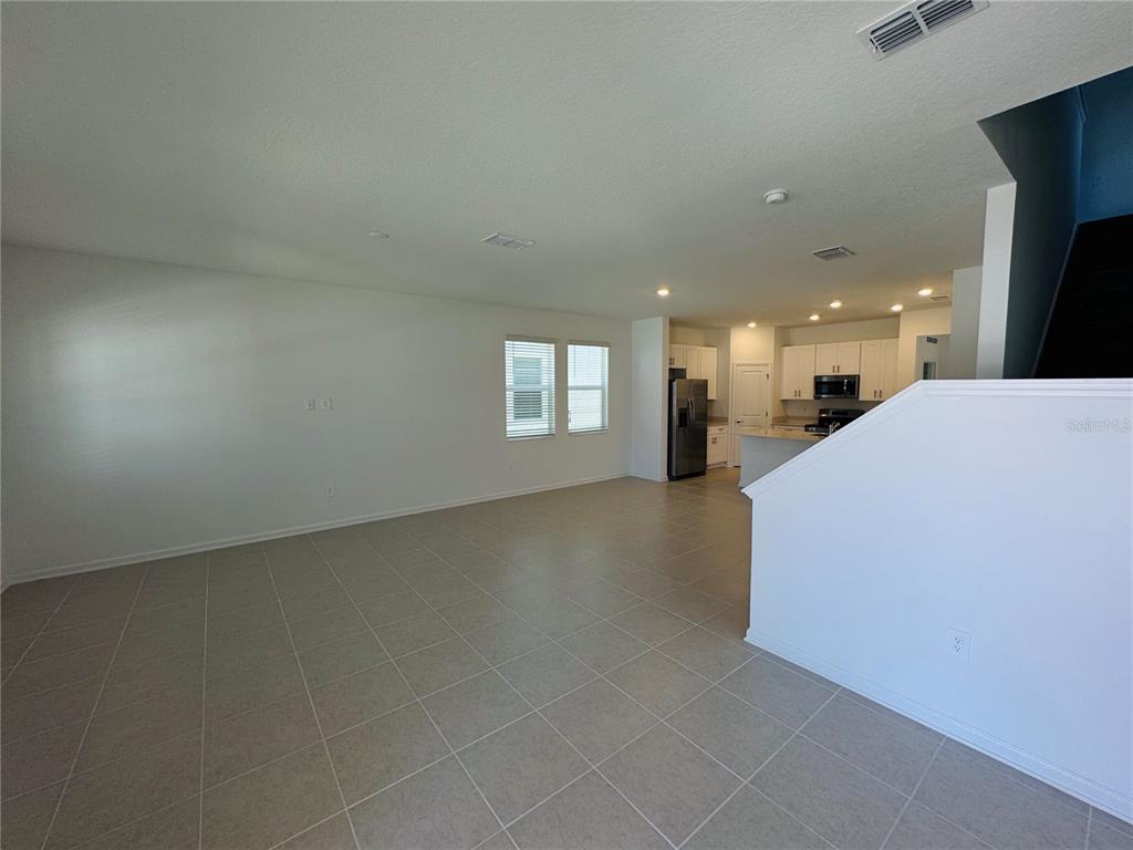 1952 Rider Rain Lane Apopka, FL 32703 - Photo 4 of 34 a view of a livingroom and window