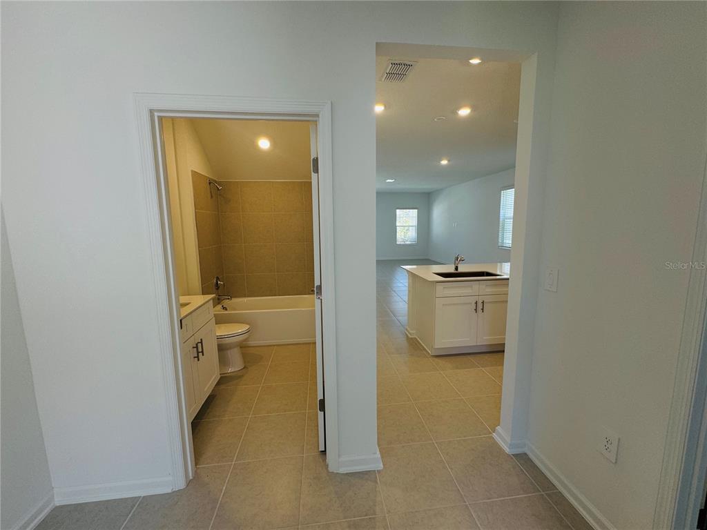 1952 Rider Rain Lane Apopka, FL 32703 - Photo 9 of 34 a view of a bathroom with a sink and a toilet