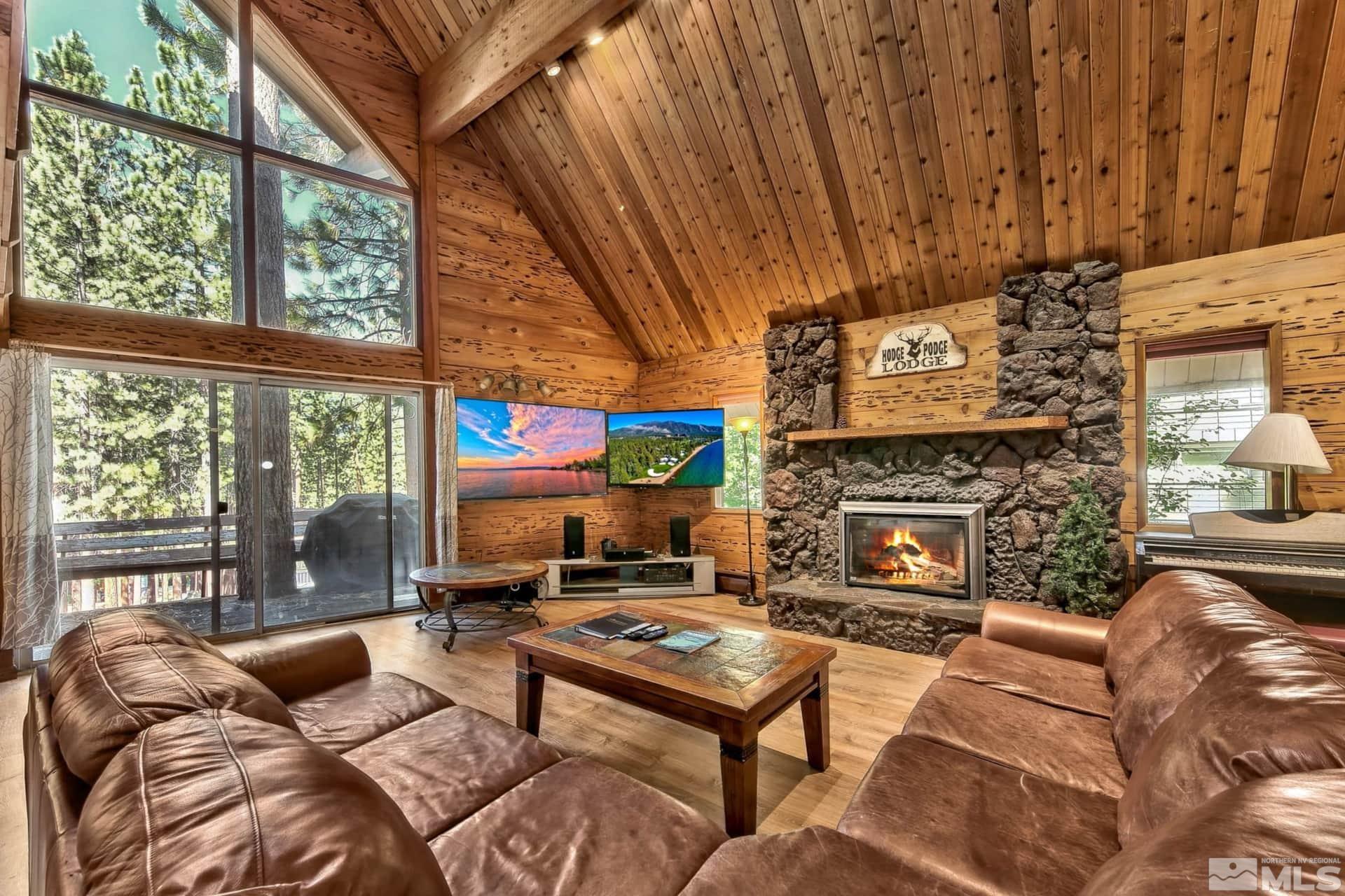 173 Juniper Drive Stateline, NV 89449 - Photo 1 of 29 a living room with furniture a fireplace and a large window