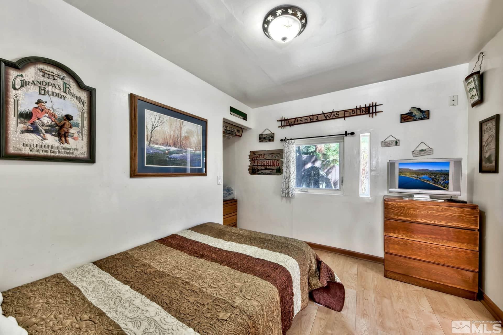 173 Juniper Drive Stateline, NV 89449 - Photo 16 of 29 a bedroom with a bed and a dresser