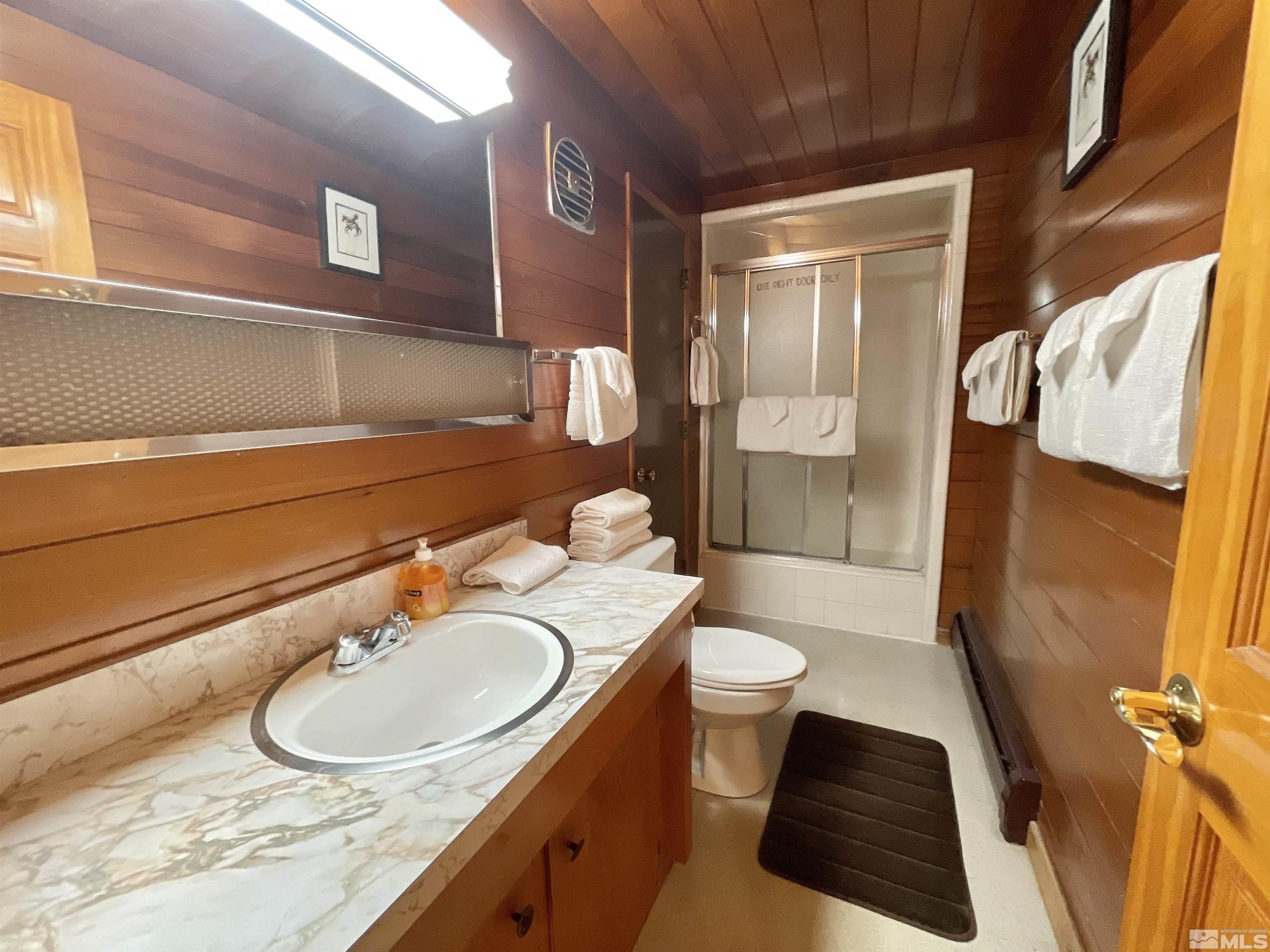 173 Juniper Drive Stateline, NV 89449 - Photo 19 of 29 a bathroom with a sink and a mirror