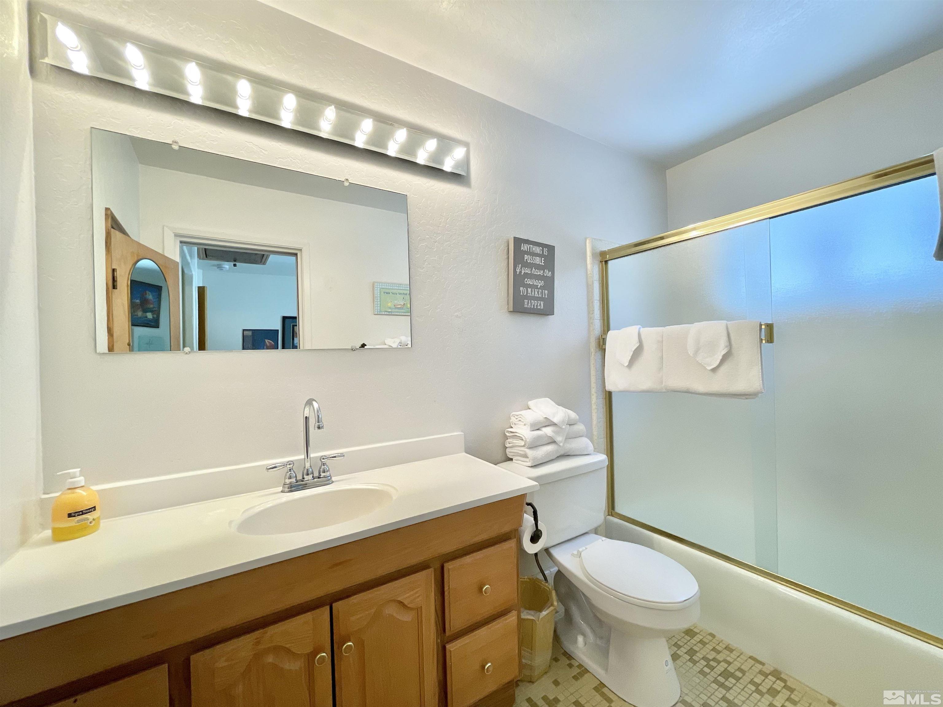 173 Juniper Drive Stateline, NV 89449 - Photo 20 of 29 a bathroom with a sink toilet and mirror