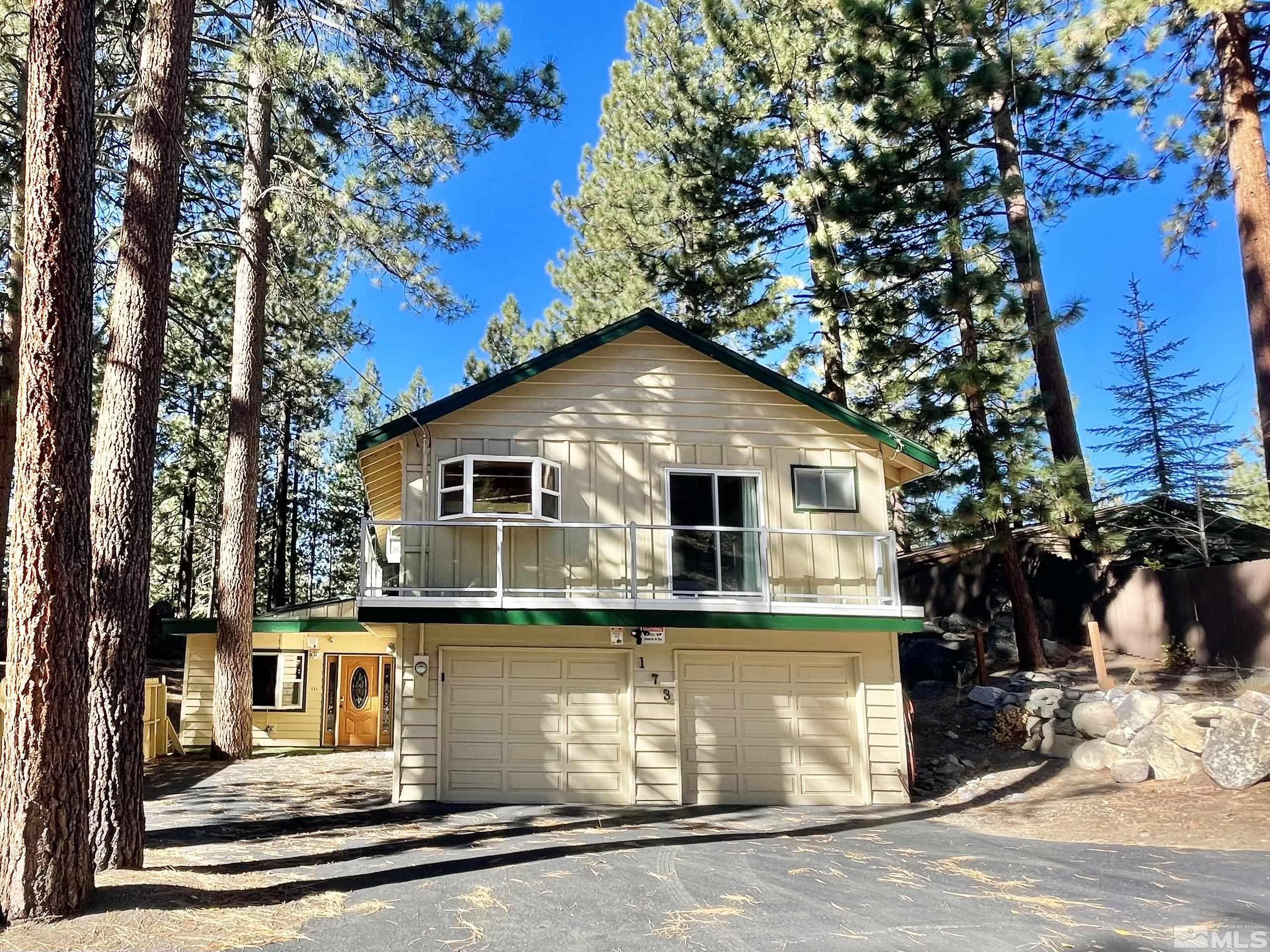 173 Juniper Drive Stateline, NV 89449 - Photo 2 of 29 a front view of a house with a yard