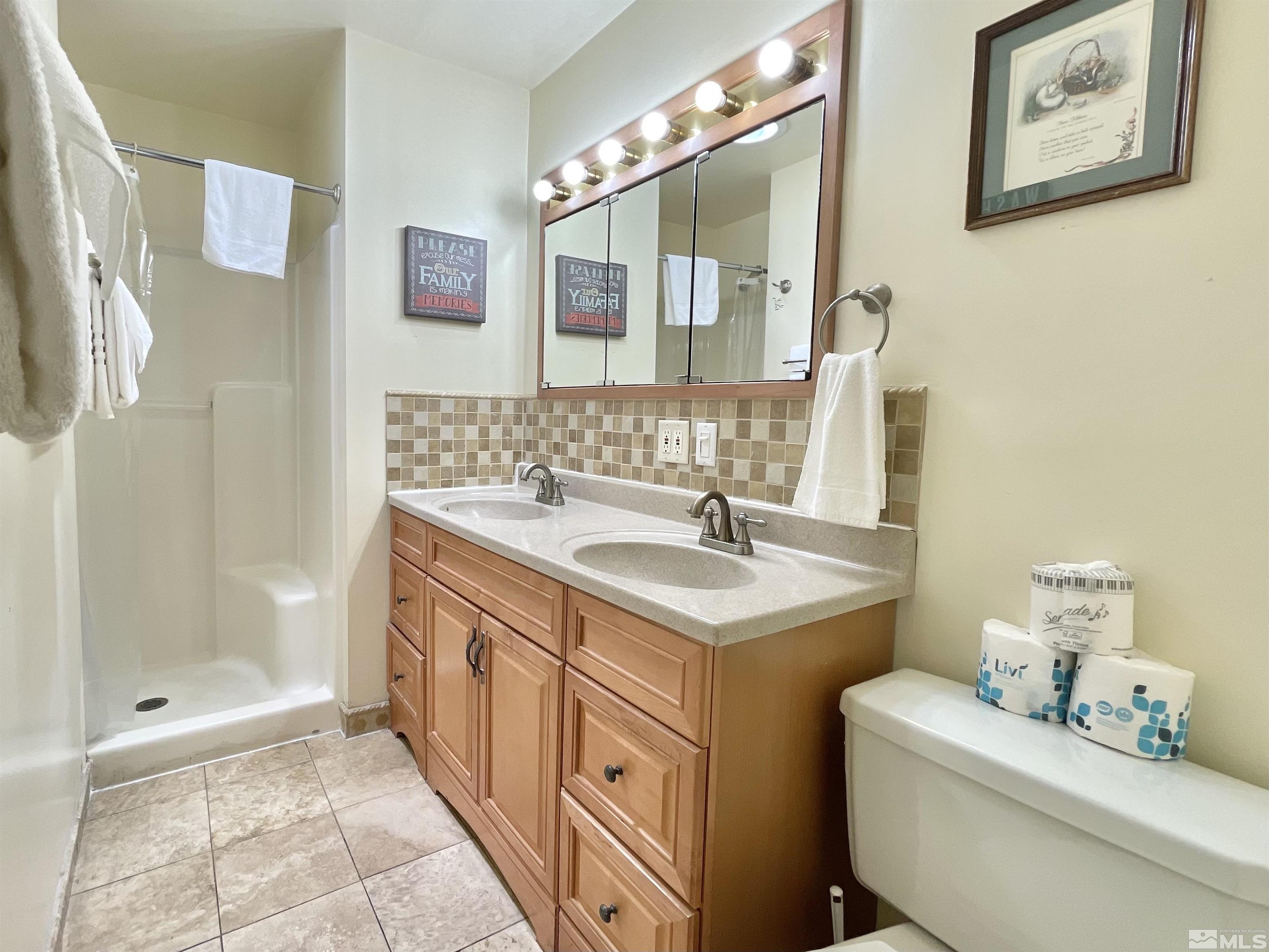 173 Juniper Drive Stateline, NV 89449 - Photo 21 of 29 a bathroom with a sink a toilet and shower