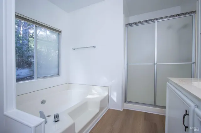 a bathroom with a bathtub and a shower