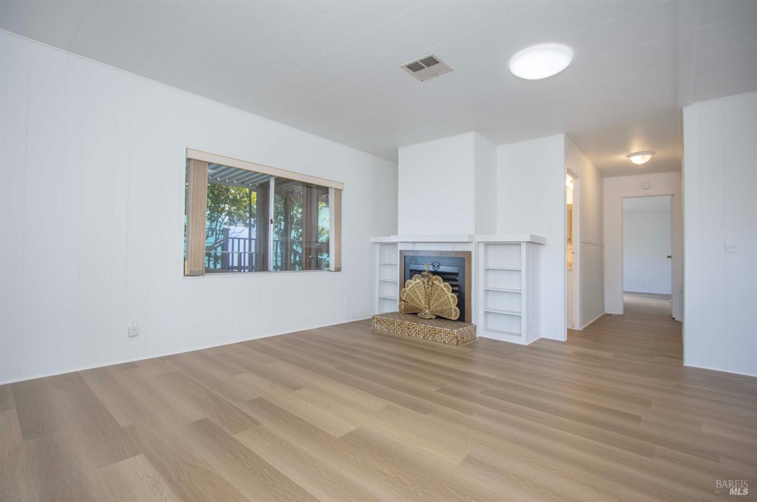 10 Fallen Leaf Way Novato, CA 94949 - Photo 6 of 30 a view of a room with wooden floor and window