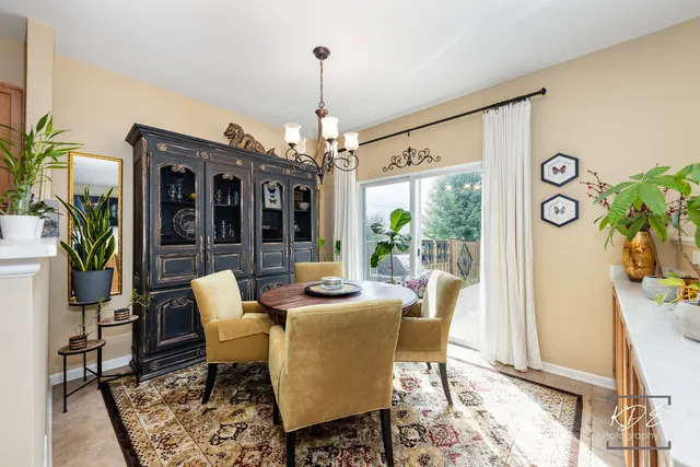 a dining room with furniture a livingroom and chandelier