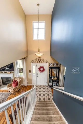 a view of a room with furniture and window