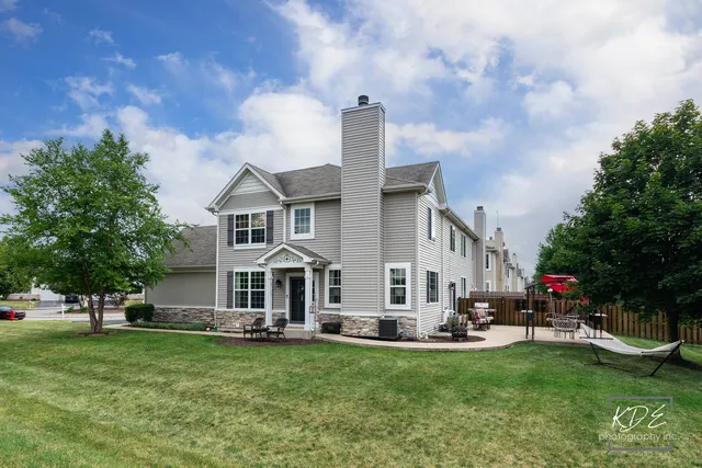 a view of a house with a yard porch and sitting area