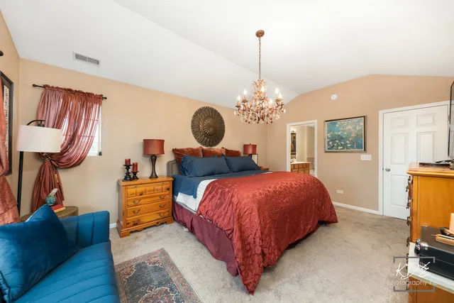 a bedroom with bed and window