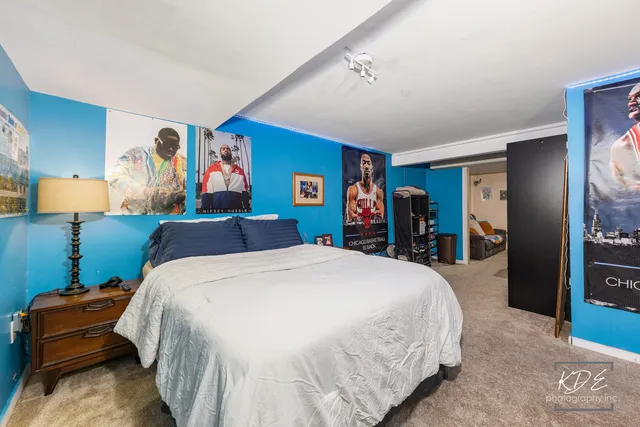 a bed room with a bed and dresser