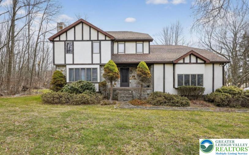 650 Chapman Lake Road Scott Township, PA 18433 - Photo 1 of 52 a front view of a house with garden