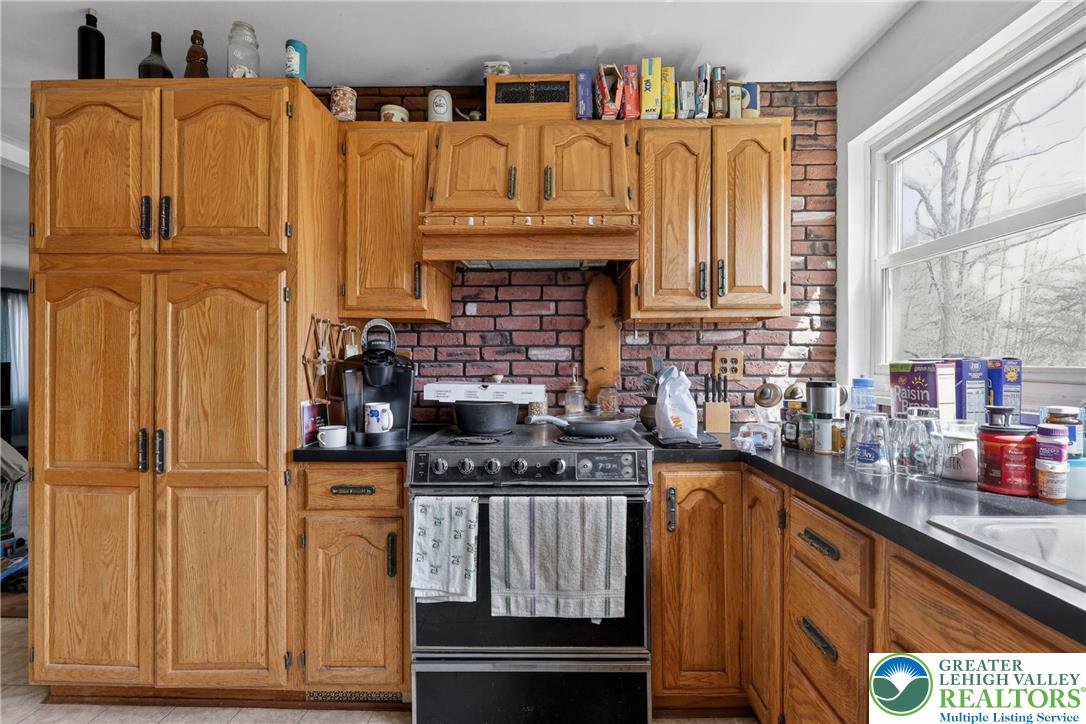 650 Chapman Lake Road Scott Township, PA 18433 - Photo 11 of 52 a kitchen with stainless steel appliances granite countertop a refrigerator and a stove top oven