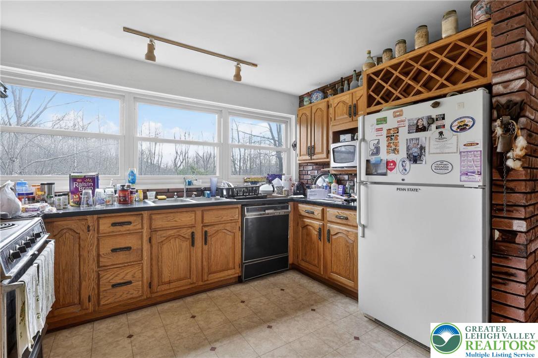 650 Chapman Lake Road Scott Township, PA 18433 - Photo 12 of 52 a kitchen with stainless steel appliances granite countertop a refrigerator and a sink