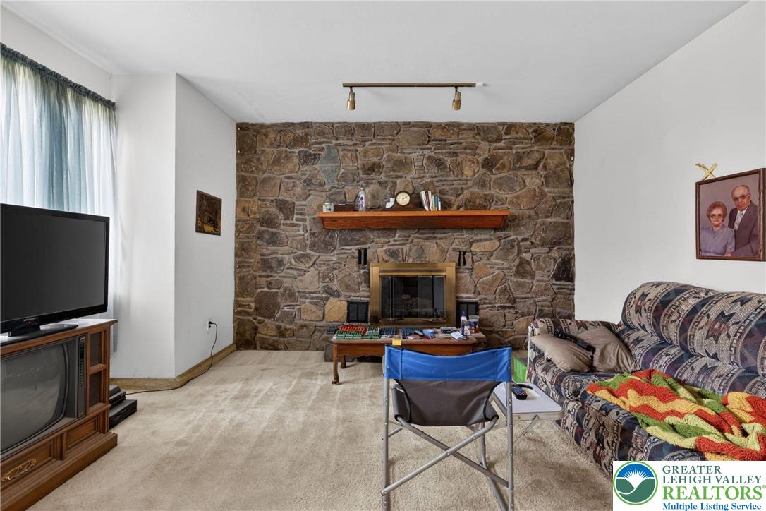 650 Chapman Lake Road Scott Township, PA 18433 - Photo 13 of 52 a living room with furniture a flat screen tv and a fireplace