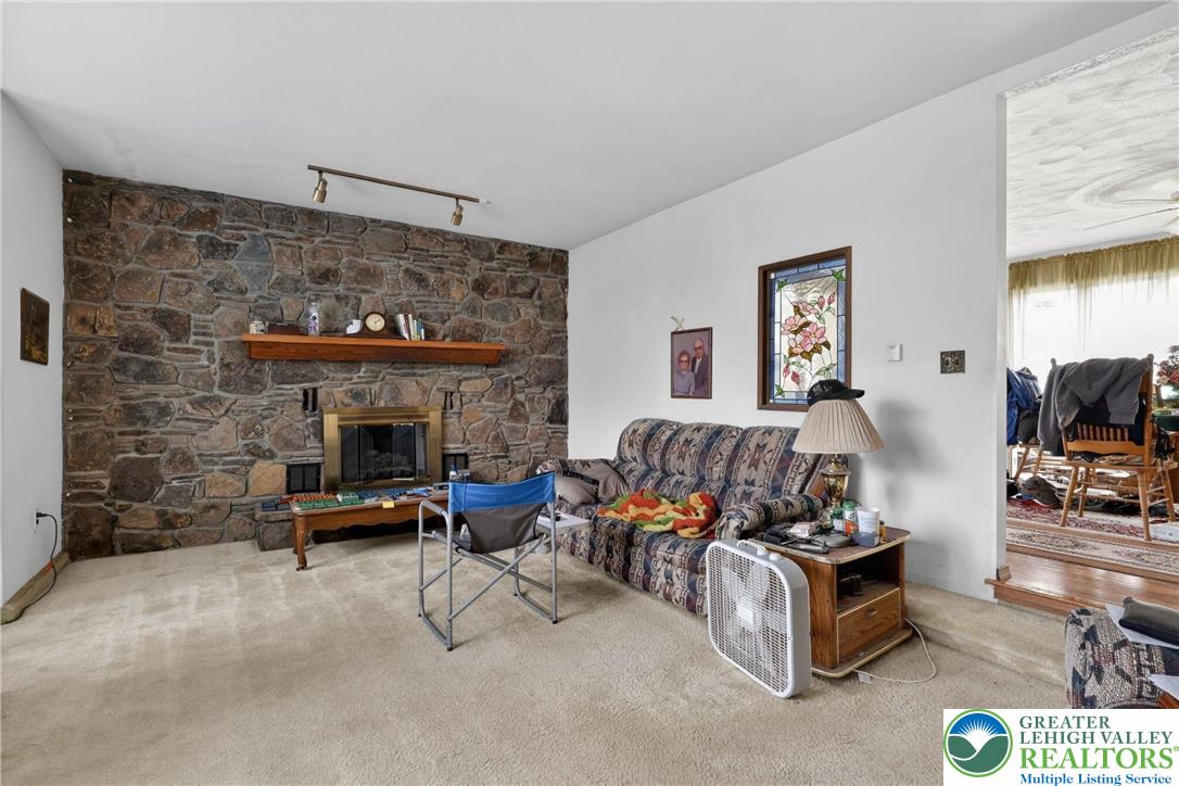 650 Chapman Lake Road Scott Township, PA 18433 - Photo 15 of 52 a living room with furniture and a fireplace
