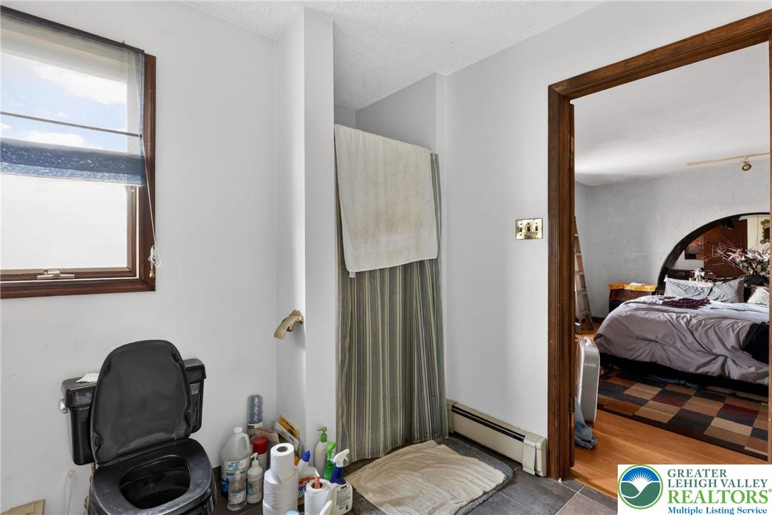 650 Chapman Lake Road Scott Township, PA 18433 - Photo 25 of 52 a bedroom with a bed and a mirror