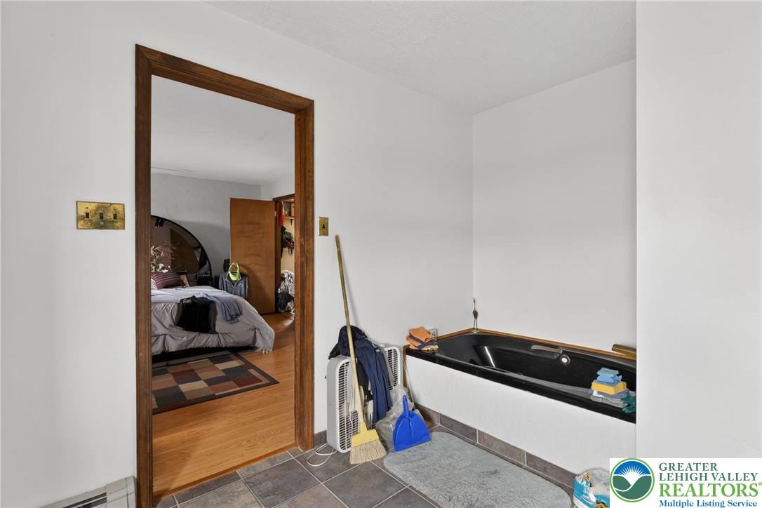 650 Chapman Lake Road Scott Township, PA 18433 - Photo 26 of 52 a bedroom with a bed and a cabinets