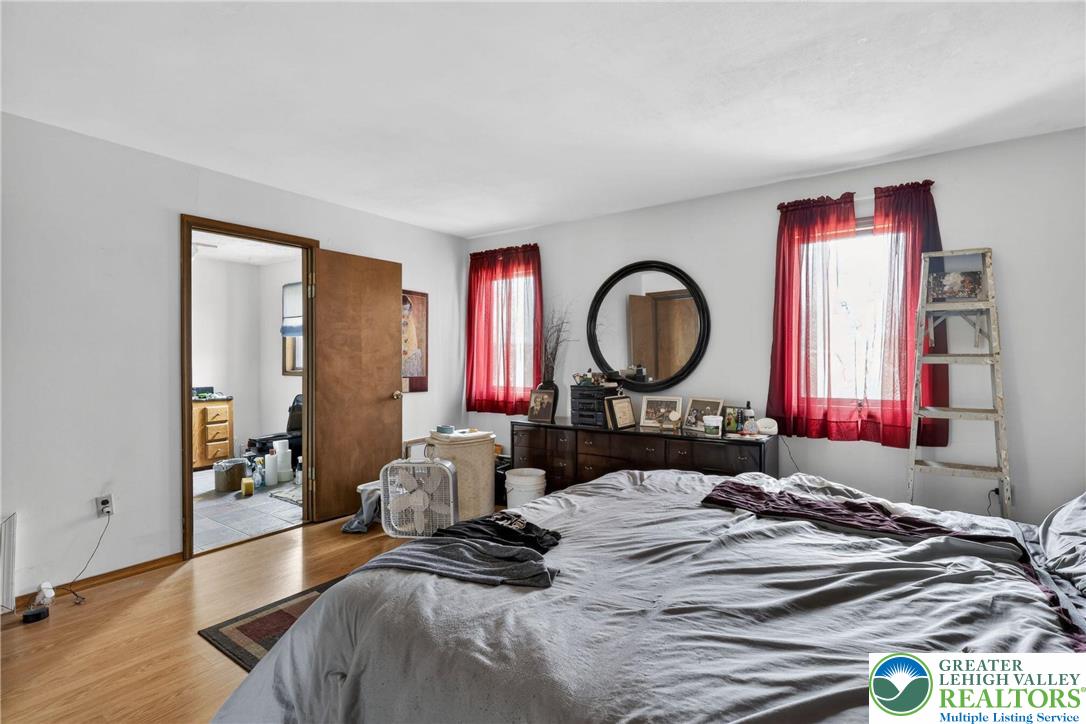 650 Chapman Lake Road Scott Township, PA 18433 - Photo 27 of 52 a bedroom with a bed and a large mirror on the dresser