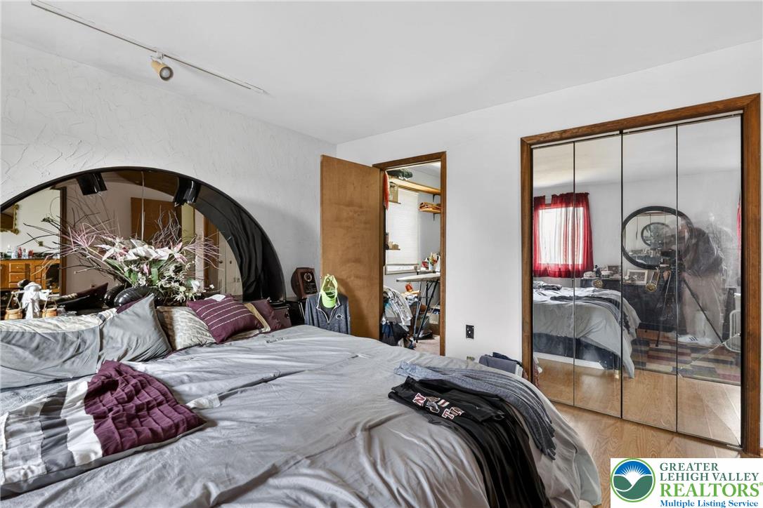 650 Chapman Lake Road Scott Township, PA 18433 - Photo 28 of 52 a bedroom with bed and a large mirror