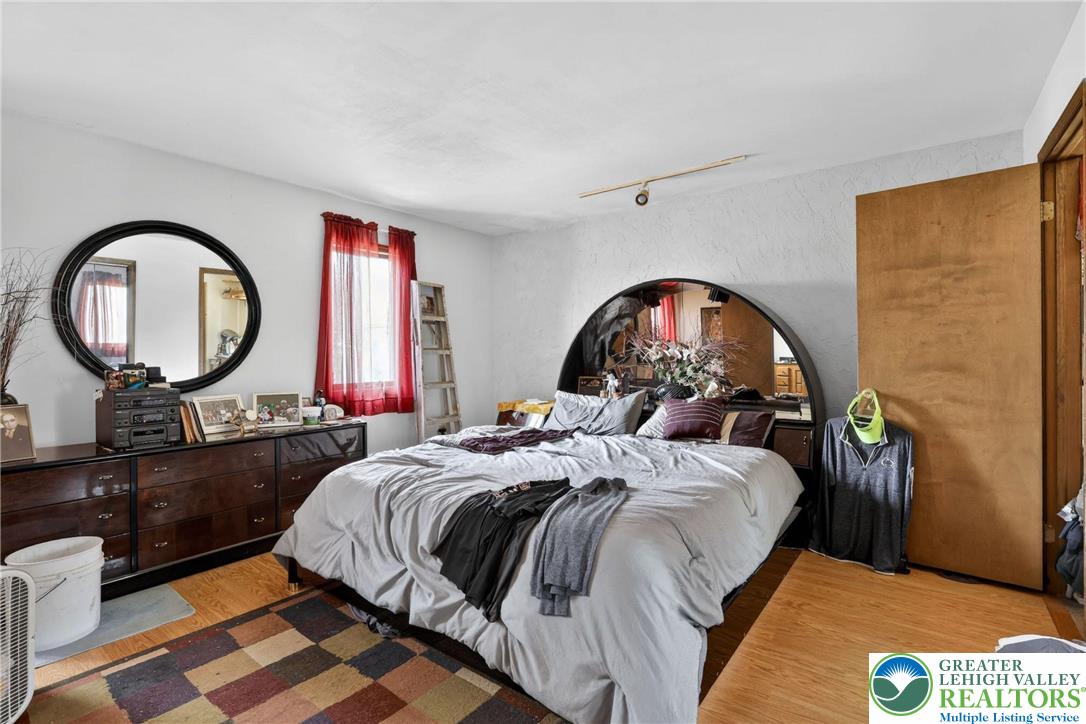 650 Chapman Lake Road Scott Township, PA 18433 - Photo 31 of 52 a bed sitting in a bedroom next to a window