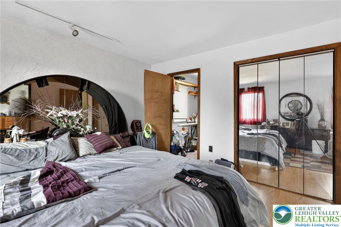 650 Chapman Lake Road Scott Township, PA 18433 - Photo 32 of 52 a bedroom with a bed a large window with the outer view