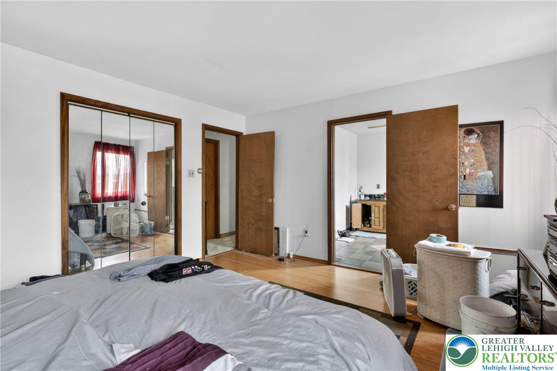 650 Chapman Lake Road Scott Township, PA 18433 - Photo 33 of 52 a bedroom with a bed and wooden floor