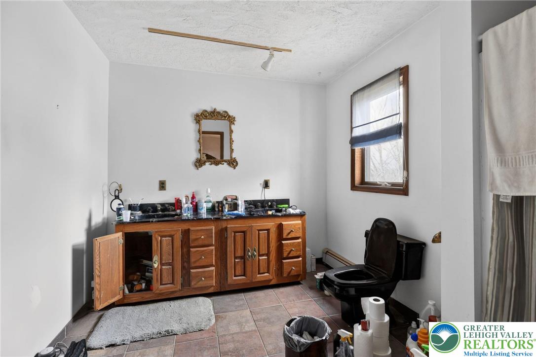 650 Chapman Lake Road Scott Township, PA 18433 - Photo 37 of 52 a hallway with a computer on a desk and chair