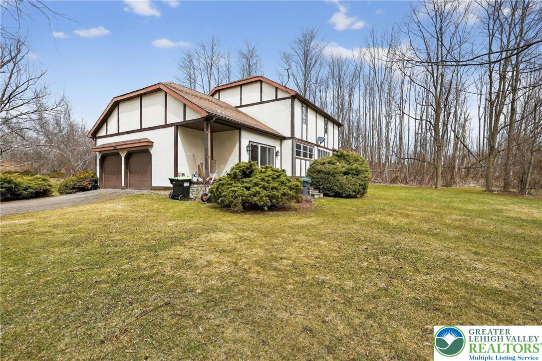 650 Chapman Lake Road Scott Township, PA 18433 - Photo 6 of 52 a front view of a house with garden