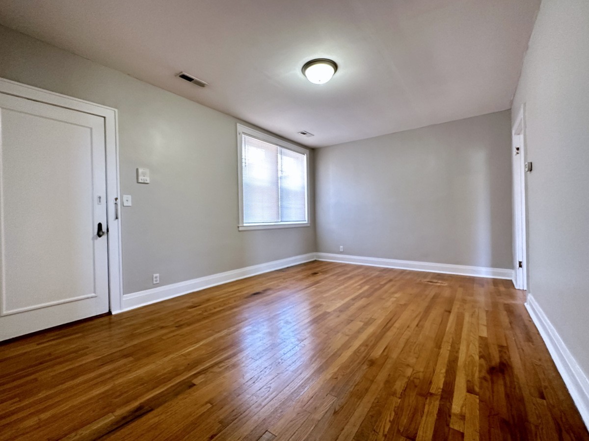 610 North 2nd Street, Unit 8 Clarksville, TN 37040 - Photo 13 of 29 an empty room with wooden floor and windows