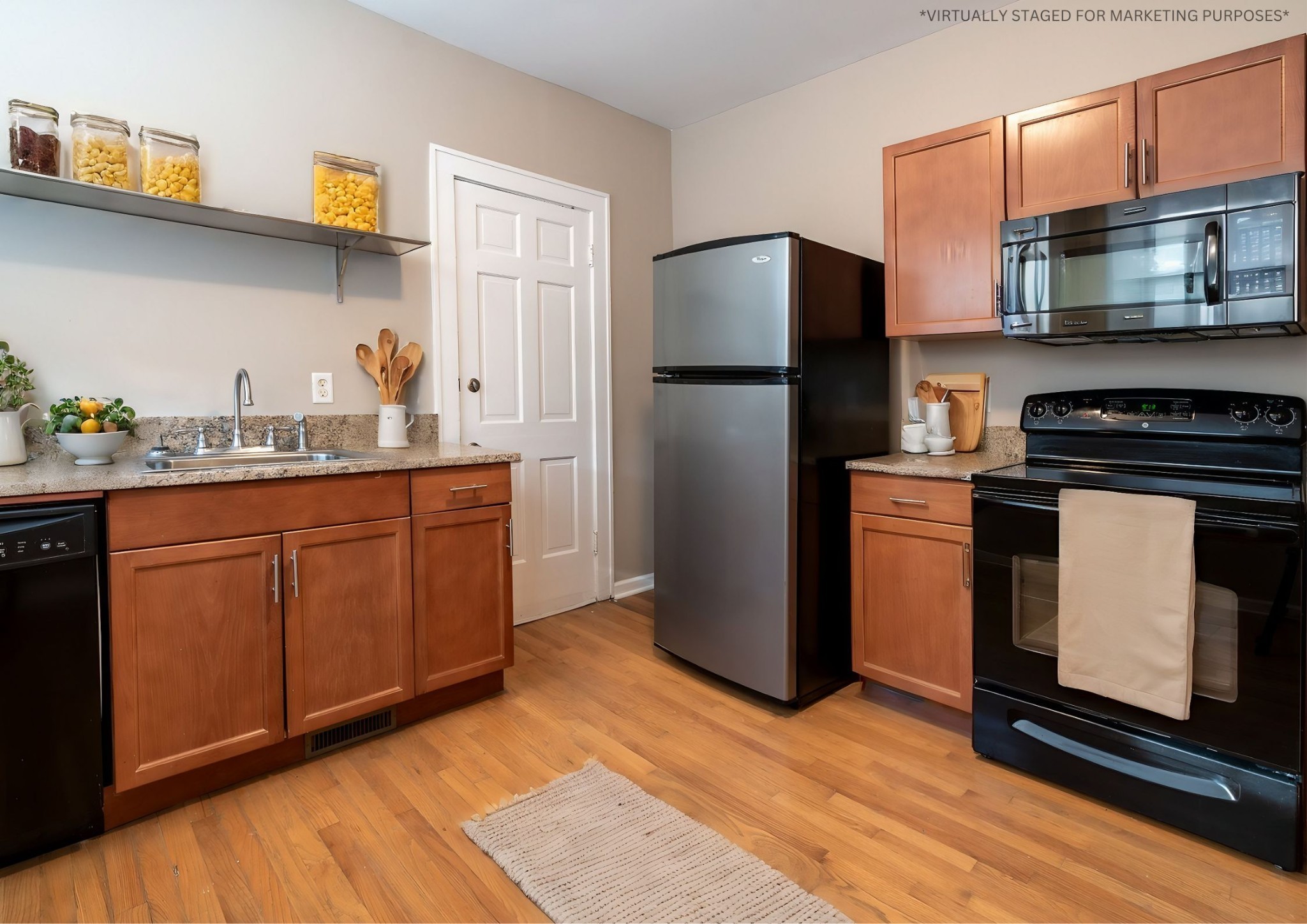 610 North 2nd Street, Unit 8 Clarksville, TN 37040 - Photo 7 of 29 a kitchen with stainless steel appliances granite countertop a stove a refrigerator and a sink
