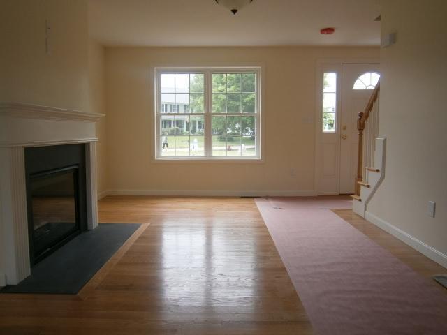 9 Knoll Top Road Forestdale, MA 02644 - Photo 4 of 16 an empty room with wooden floor and windows