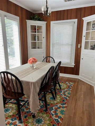 a view of a dining room with furniture and window