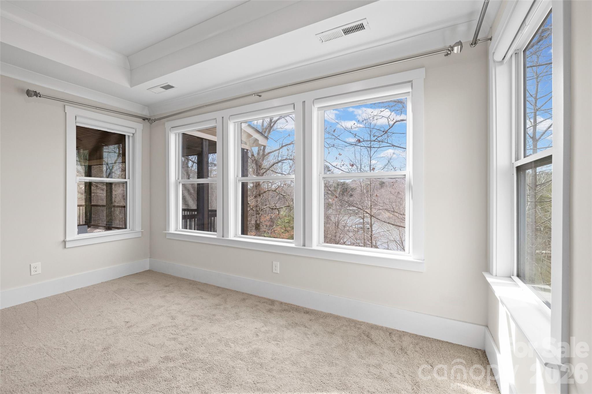 12039 Spinnaker Drive Tega Cay, SC 29708 - Photo 14 of 48 a view of an empty room with a window